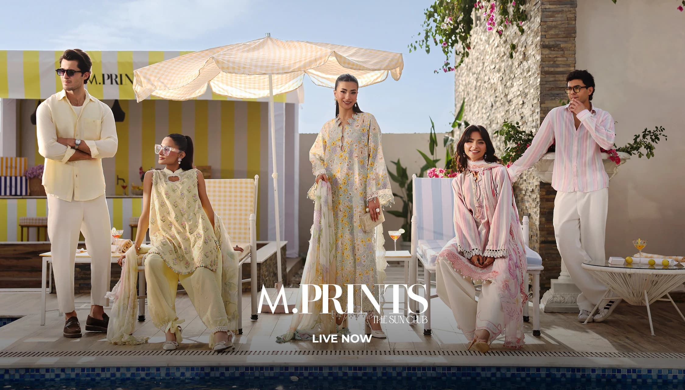 M.Prints at The Sun Club — printed summer resortwear beside a poolside cabana