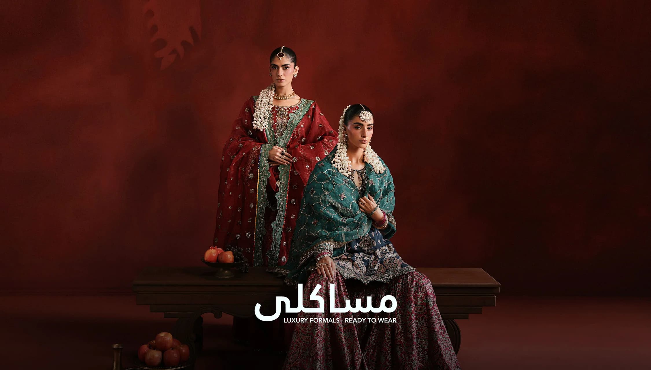 Masakli luxury formals — two models in embroidered red and green ready-to-wear