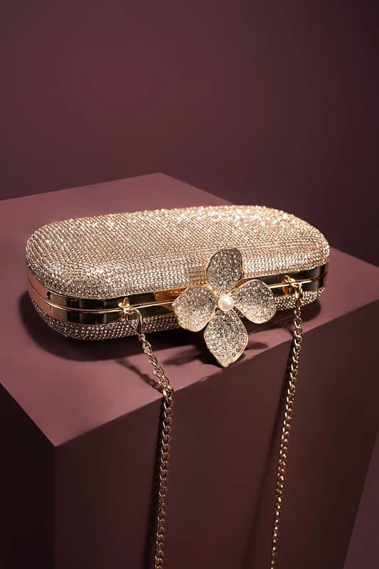Crystal-set box clutch with a flower clasp and chain strap