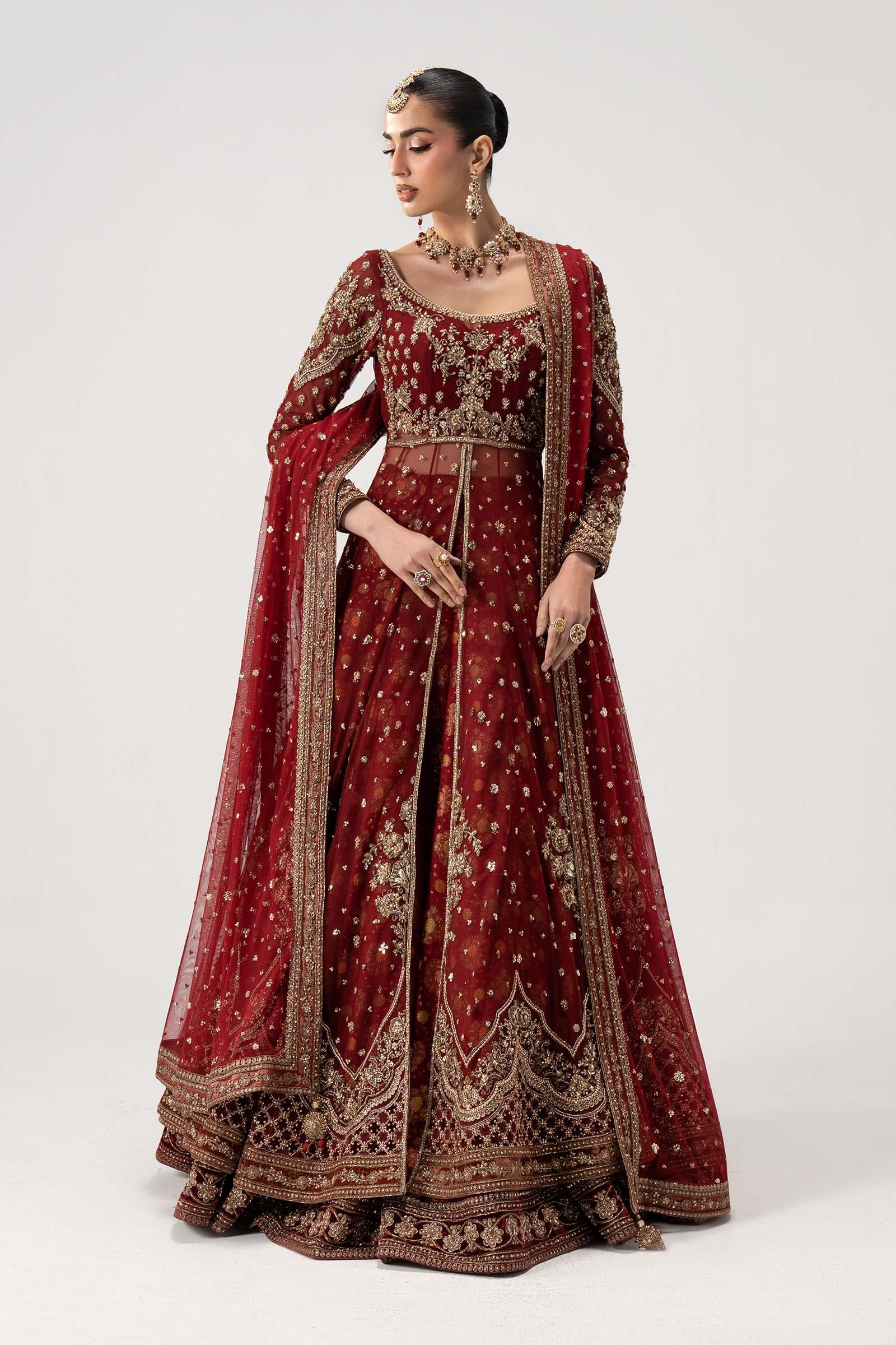 Model in a maroon zardozi couture gown