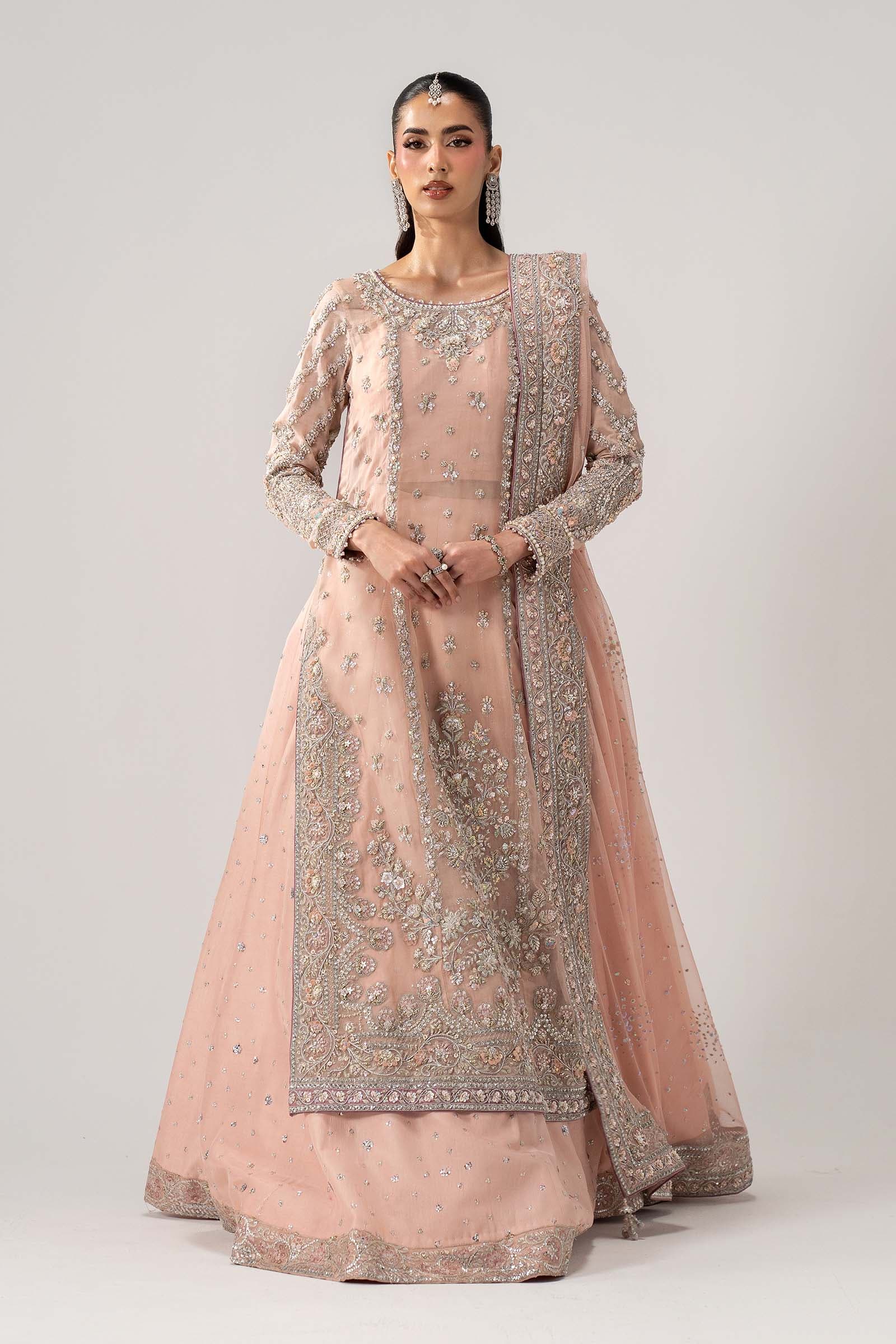 Model in a blush couture gown with silver thread work