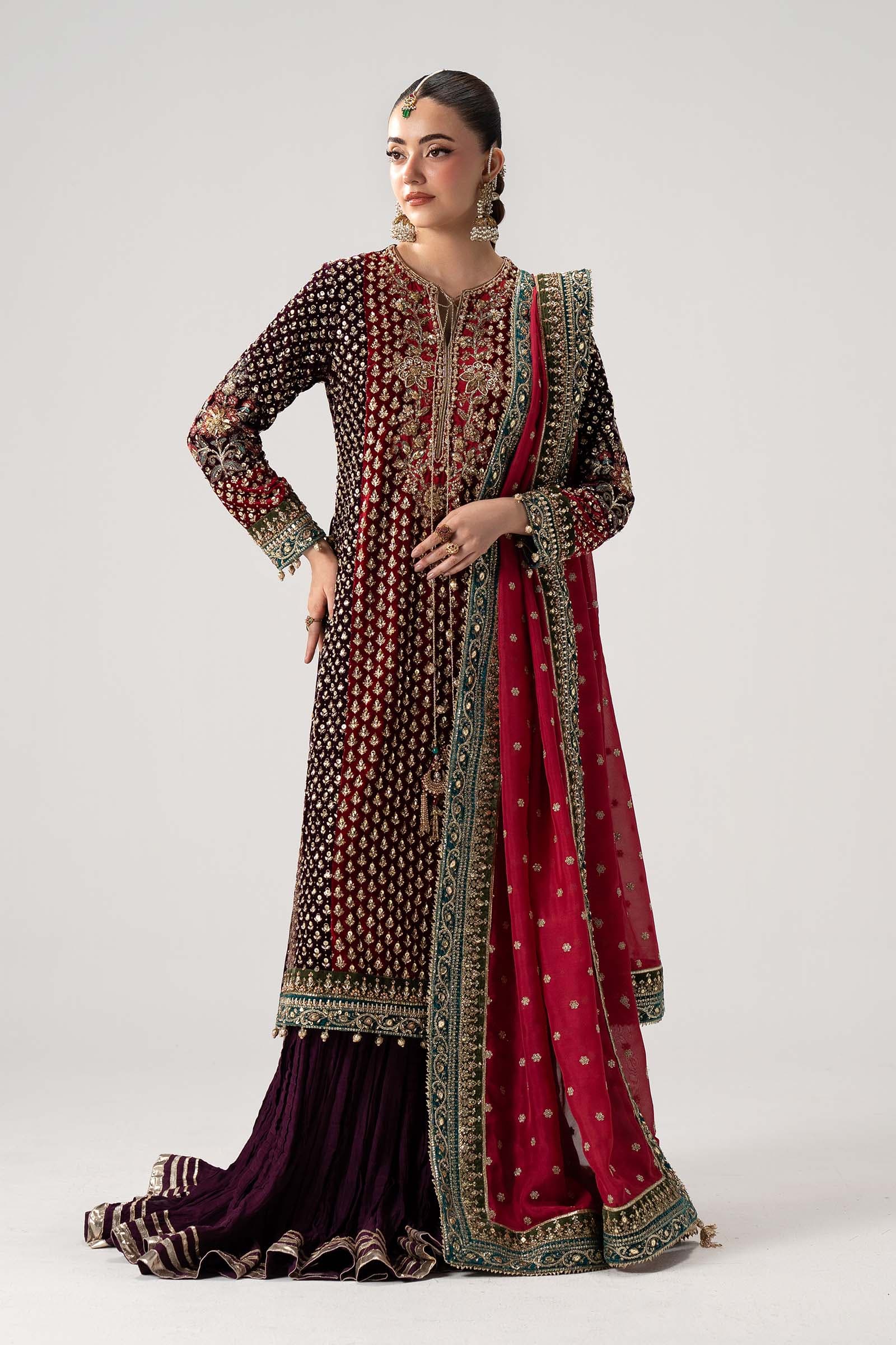Model in a plum couture kurta and sharara