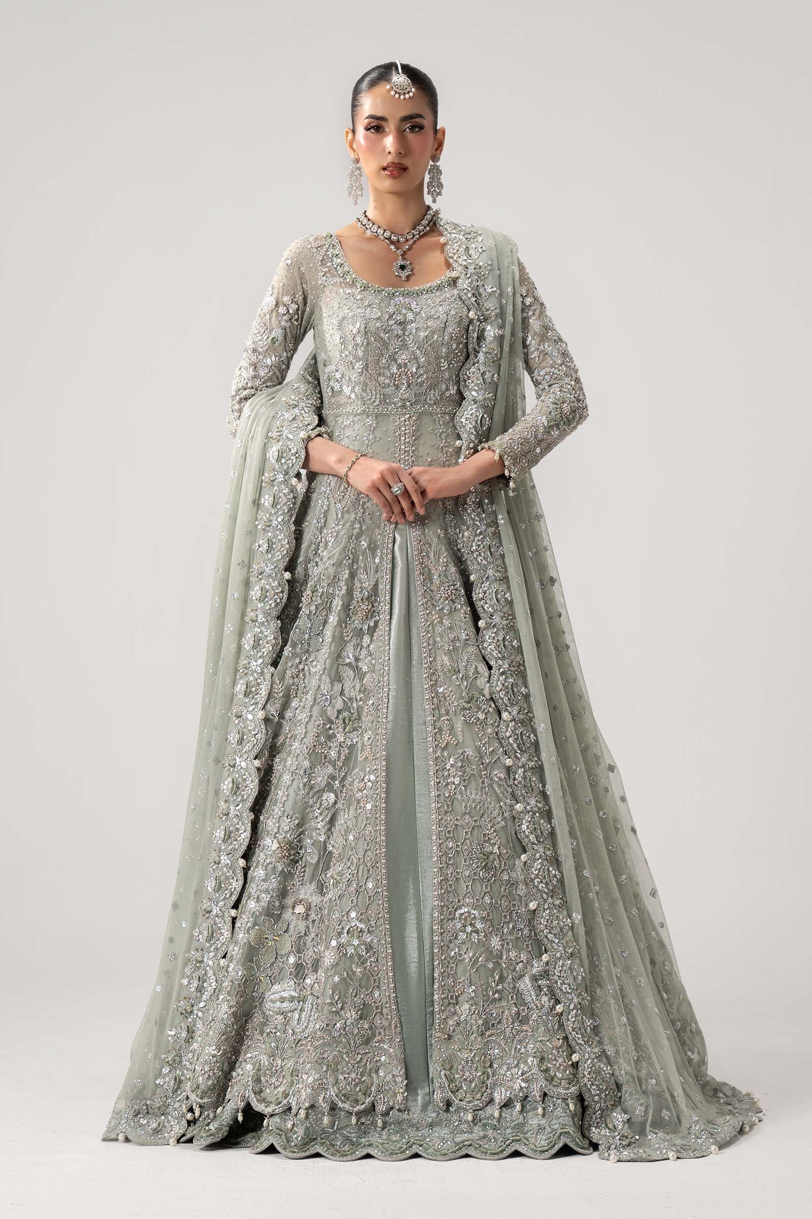 Model in a mint couture lehenga with a sheer veil