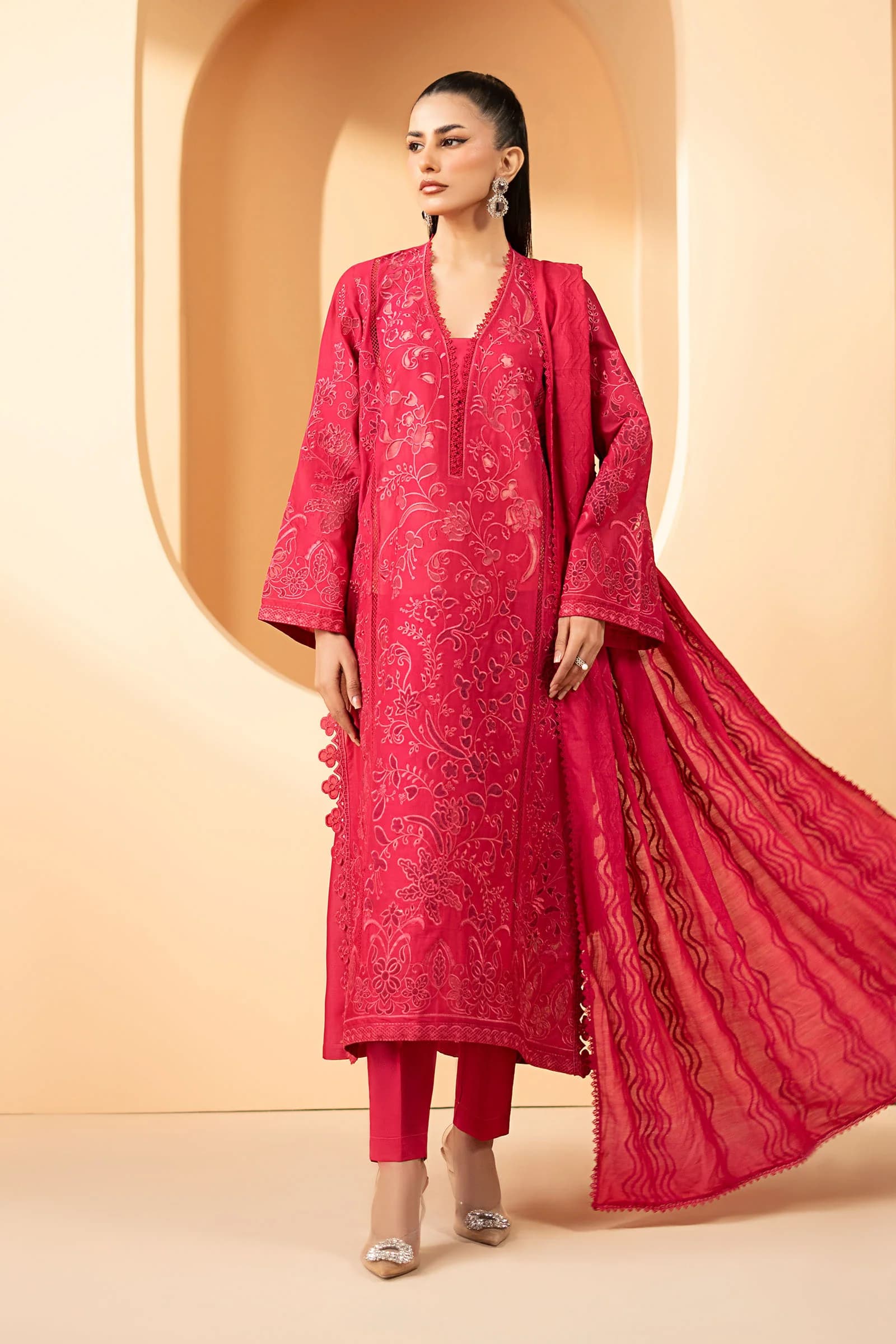 Model in a fuchsia embroidered suit with dupatta